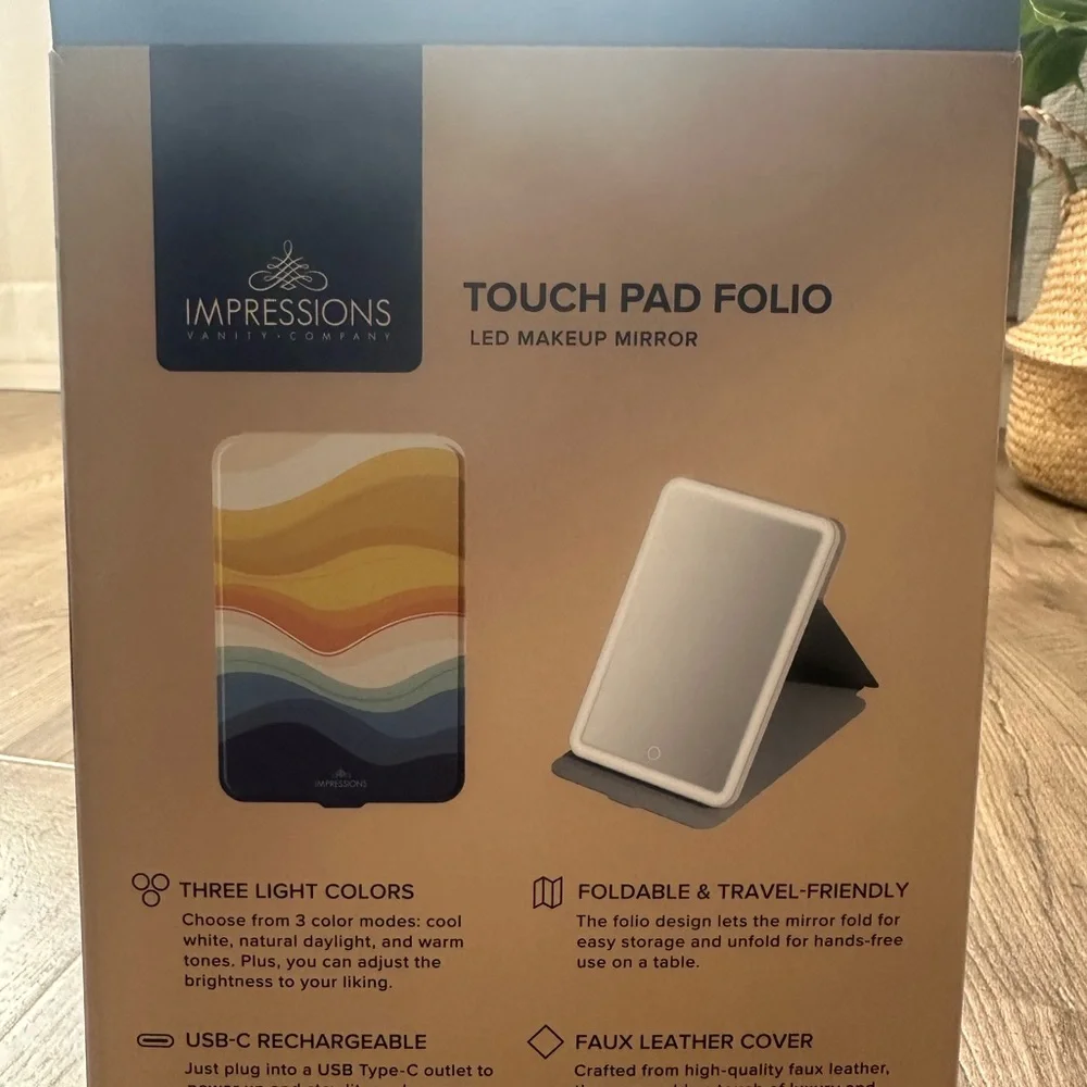 Impressions Vanity rechargeable LED mirror with Vibrant Wave Design